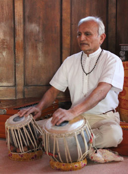 Shanti plays the tablas